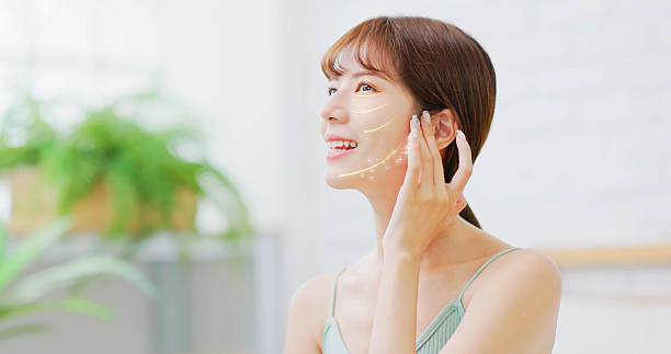 asian woman feeling happy after skin tightening treatment enjoying youthful lifted facial appearance with confidence and glow